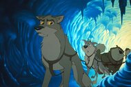 Balto (Kevin Bacon) looks back at other sled dogs in an icy cave in Balto (1995).