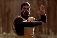 Scorpion (Chris Kassamassa) strikes a martial arts pose in Mortal Kombat (1995).
