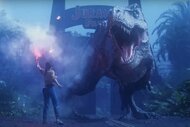 A giant T-Rex roars at a woman holding a torch.