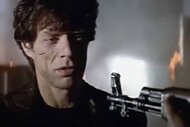 Victor Vacendak (Mick Jagger) has a gun pointed at him in Freejack (1992).