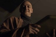 Kevin (James McAvoy) smiles while wearing a robe in Split (2017).