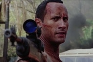 Beck (Dwayne Johnson) dons a gun in The Rundown (2003).