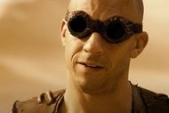 Riddick (Vin Diesel) wears dark goggles in Riddick (2013).