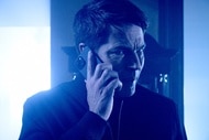 Luke Roman (Tim Rozon) speaks on the phone with a concerned look on his face in SurrealEstate Episode 301.