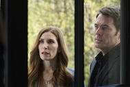 Susan Ireland (Sarah Levy) and Luke Roman (Tim Rozon) look through a window on SurrealEstate Episode 302.