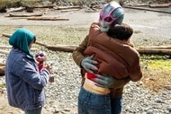 Resident Alien Harry and Max hug while Sahar and Bridget look on