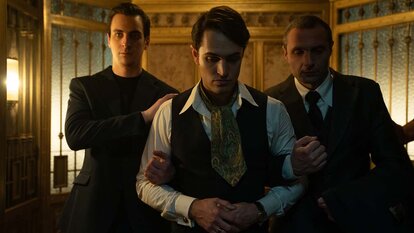 Young Winston Scott (Colin Woodell) is held by henchmen in The Continental: From The World of John Wick Season 1