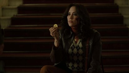 KD (Mishel Prada) holds a coin in The Continental: From The World of John Wick Season 1