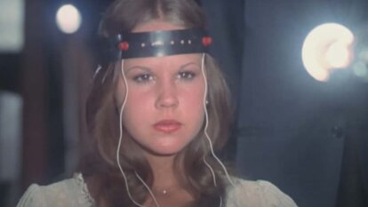 Regan MacNeil (Linda Blair) concentrates while wearing a brain wave monitor in Exorcist II: The Heretic (1977).