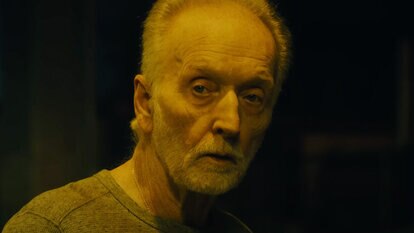 John Kramer (Tobin Bell) looks menacing in yellow light in SAW X (2023)