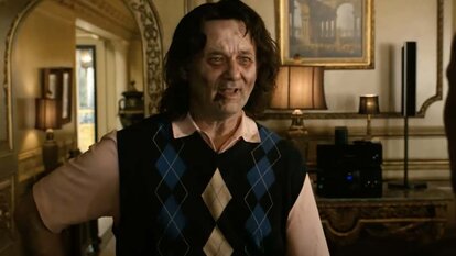 Bill Murray appears zombie-like in a sweater vest in Zombieland (2009).