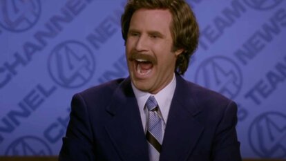 Ron Burgundy (Will Ferrell) does mouth exercises in a suit in Anchorman: The Legend of Ron Burgundy (2004).