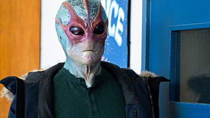 Alien Harry (Alan Tudyk) stands in Resident Alien Episode 305.
