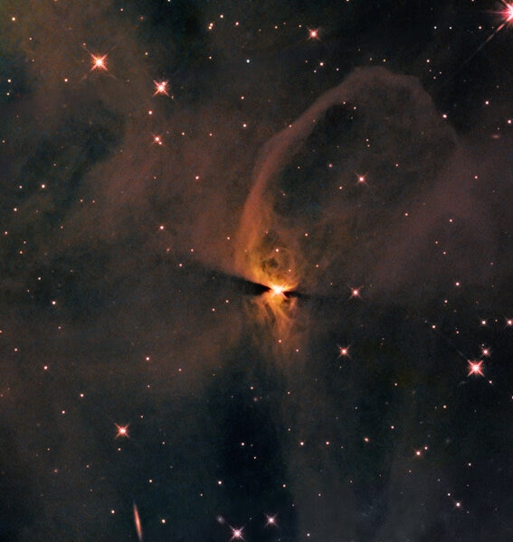 Hubble image of a protostar's disk casting a shadow
