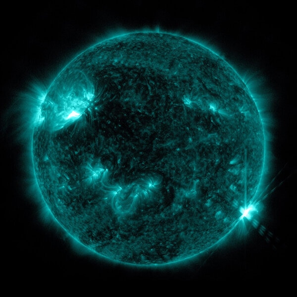 A blue colorized image of a solar flare near Earth captured on April 19, 2022