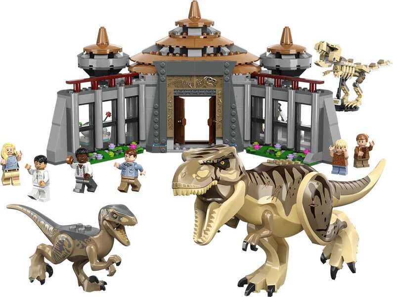 A product shot of dinosaurs and a barricade with velociraptors from a Jurassic Park Lego set