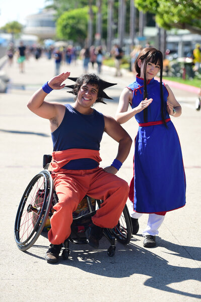 Cosplayers dress as Goku and Chi-Chi on Day 2 of SDCC 2023