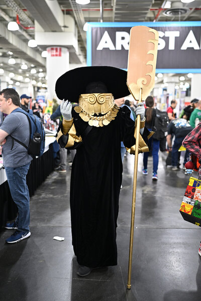 A cosplayer posing as Charon from Hades attends New York Comic Con 2023 - Day 2 at Javits Center.
