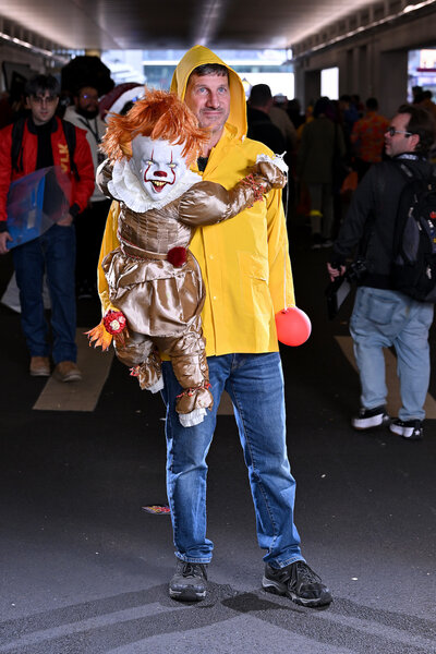 A cosplayer poses as Pennywise and Georgie from IT during New York Comic Con 2023 - Day 4 at Javits Center.