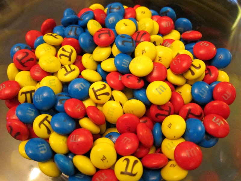 Approximating the shape of an M&M as an oblate spheroid, the volume of chocolate in it is 4/3 π a2 b, where a is the long radius and b the short one. Credit: AmitP on Flickr