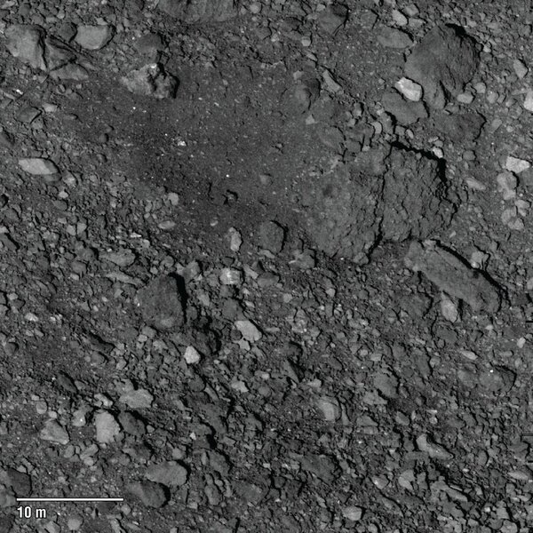A relatively rare clear(ish) spot (top center) on the surface of Bennu is a candidate for the OSIRIS-REx spacecraft to land and collect a sample of the asteroid. This was taken from a distance of about 5 km. Credit: NASA/Goddard/University of Arizona