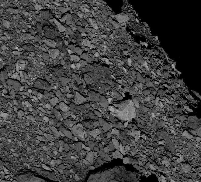 The surface of Bennu is not exactly smooth. Taken from 5 km up, this OSIRIS-REx image shows boulders of all sizes. The biggest (the light-colored one left of center) is over 7 meters wide. Credit: NASA/Goddard/University of Arizona