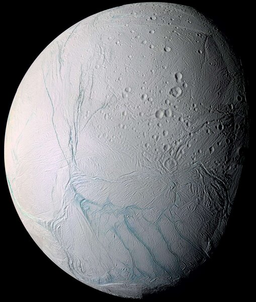 A visible light mosaic of Enceladus, a tiny icy moon of Saturn. Note the parallel lines near the south pole; those are the tiger stripes were geysers of water erupt. Credit: NASA/JPL/Space Science Institute