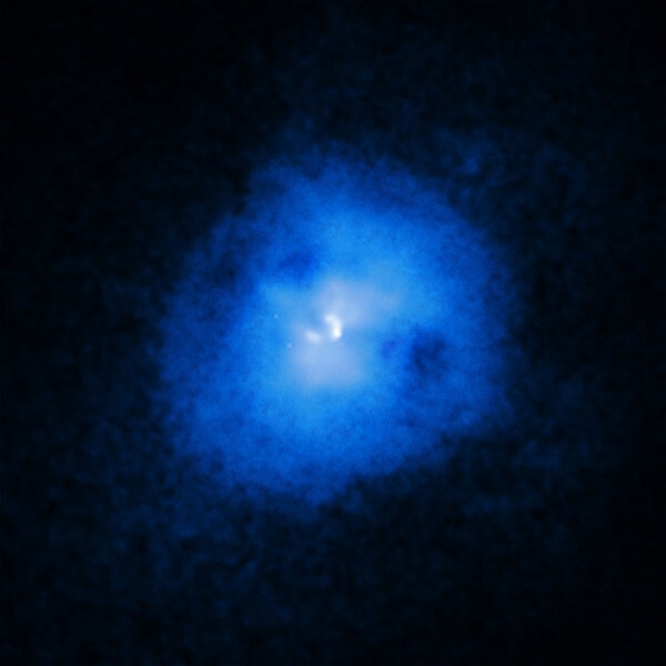 Hot gas in the cluster Abell 2597 glows in X-rays, while bubbles of gas rising inside appears as dark cavities, like eye sockets in a ghostly face. Credit: X-ray: NASA/CXC/Michigan State Univ/G.Voit et al.