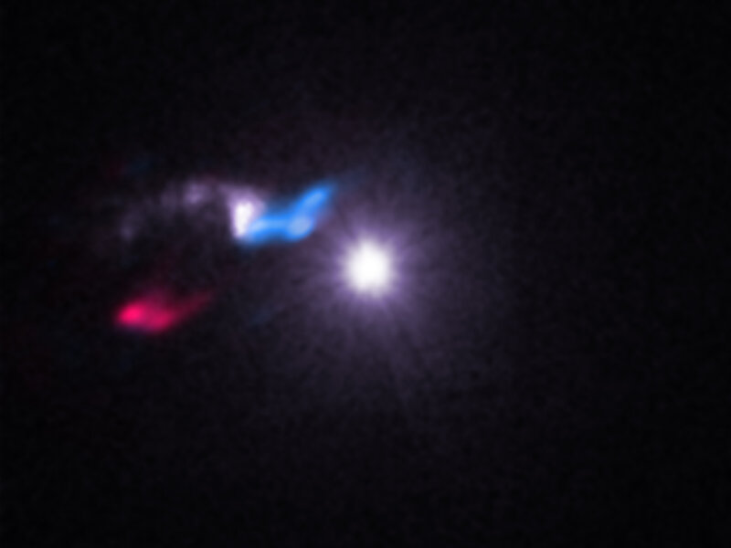 Cygnus X-3 (center) is a powerful X-ray source, but near it in the sky (left) is a small cloud of gas and dust also seen in X-rays (shown in white/purple).