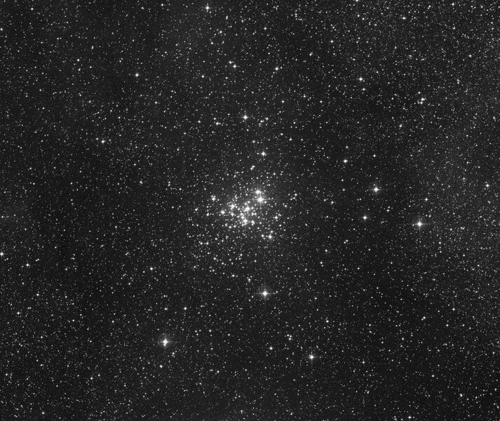 The open star cluster NGC 6321 sits near the cometary globule called the Dark Tower, and blasts it with radiation, giving it its comet-like shape. Credit: Digitized Sky Survey via SkyView