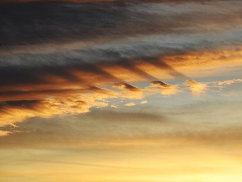 Fluctus at sunset: Wave clouds created by a layer of air flowing over another. The shadows are striking. Credit: Phil Plait