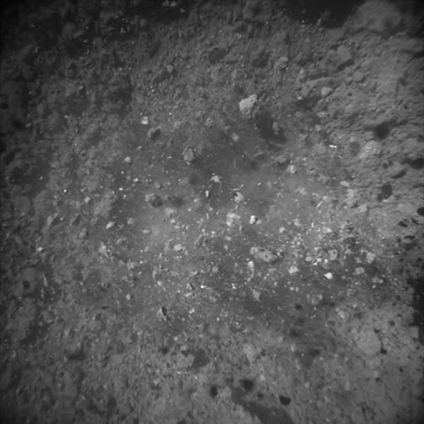 An image taken moments after the bullet impact show debris from the surface of the asteroid Ryugu flying off, some of which was collected for return to Earth. 