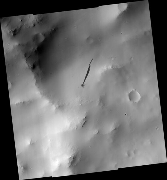 A wider view of the impact site shows the varying terrain, covered in light-colored dust. Credit: NASA/JPL/University of Arizona