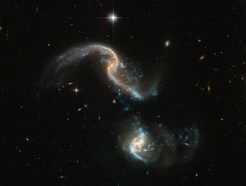 Two colliding galaxies make up Arp 256 (the top one is Arp 256N, and the bottom Arp 256S), and are in the early stages of the process. Credit: ESA/Hubble, NASA