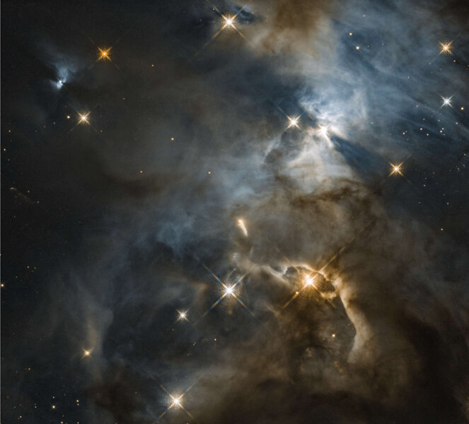 The star EC 82 (upper right) casts two long shadows onto the nebulosity around it in this Hubble image of a young star-forming region. Credit: NASA, ESA, and STScI