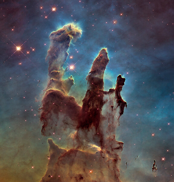 The Pillars of Creation: Towering star-forming clouds of gas and dust in the Eagle Nebula. Credit: NASA, ESA/Hubble and the Hubble Heritage Team (STScI/AURA)