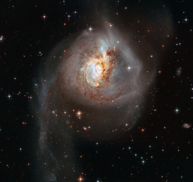 NGC 3256 is the aftermath of a cosmic collision, two huge spiral galaxies that have smashed into each other and merging. Credit: ESA/Hubble, NASA
