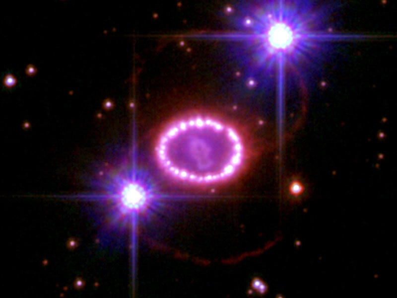 The three rings of gas surrounding Supernova 1987A, imaged by the Hubble Space Telescope to celebrate the 20th anniversary of the event. Credit: NASA, ESA, and R. Kirshner (Harvard-Smithsonian Center for Astrophysics)