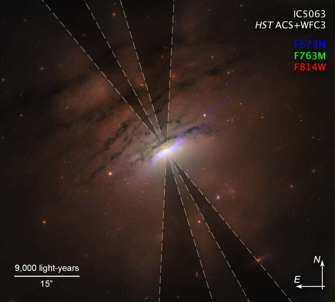 An annotated version of the IC 5063 image showing the dark rays more clearly. The cameras and filters used (one red (673 nanometers) and two in the near infrared (763 and 814 nm)) are listed in the upper right.