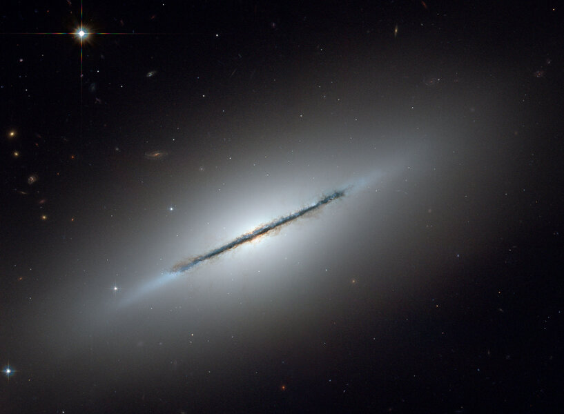 The nearby galaxy NGC 5866 is a disk galaxy seen almost exactly edge-on. Credit: NASA, ESA, and The Hubble Heritage Team (STScI/AURA)
