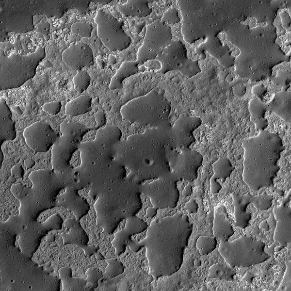 Zooming in on the strange structures in Ina, the smooth regions are cratered and elevated about a rougher, lower terrain. Credit: NASA/GSFC/Arizona State University