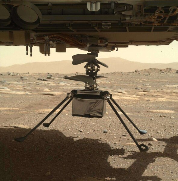 The Ingenuity flying drone hanging underneath the Perseverance rover shortly before it was dropped on the surface of Mars. Credit: NASA/JPL-Caltech