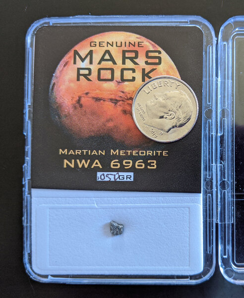 A sample of a meteorite from Mars (weighing 0.05 grams; the dime is for scale) from my own personal collection. Credit: Phil Plait