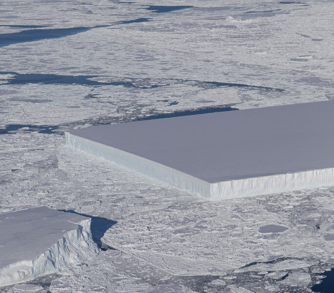 The straight edge and right angles of a large iceberg seen by a NASA IceBridge airplane in October 2018. Credit: NASA / Jeremy Harbeck