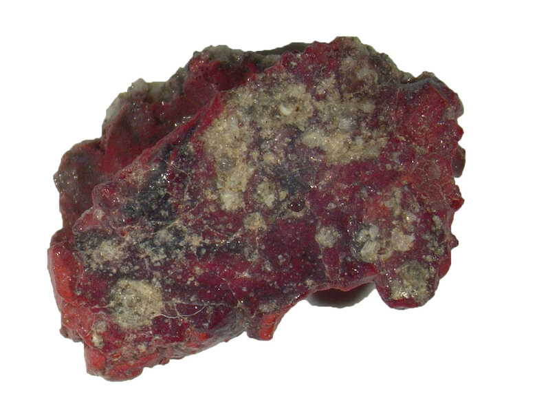 Red trinitite, a glassy mineral created in the first atomic bomb test in New Mexico in 1945. Image credit: Luca Bindi and Paul J. Steinhardt.