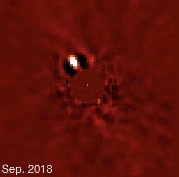 The exoplanet Beta Pictoris b, a super-Jupiter still glowing with heat leftover from its birth, re-emerges from the glare of its host star as it orbits. Credit: Lagrange, et al.