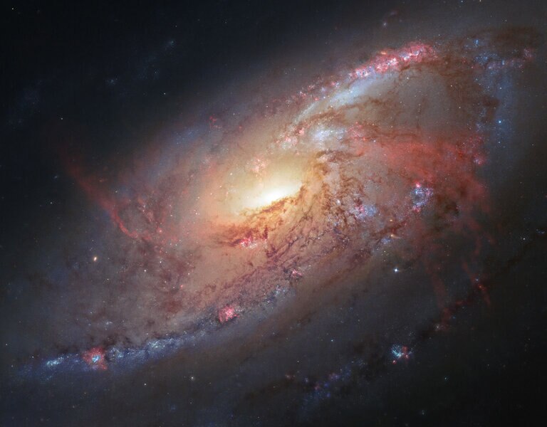 The inner disk of the spiral galaxy M 106 shows a pair of “anomalous arms”, actually gas heated by emission from the central black hole. Credit: NASA, ESA, the Hubble Heritage Team (STScI/AURA), and R. Gendler (for the Hubble Heritage Team). Acknowledgmen