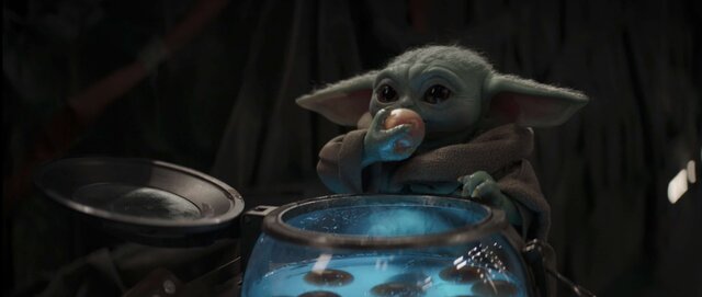 Baby Yoda eating eggs in The Mandalorian