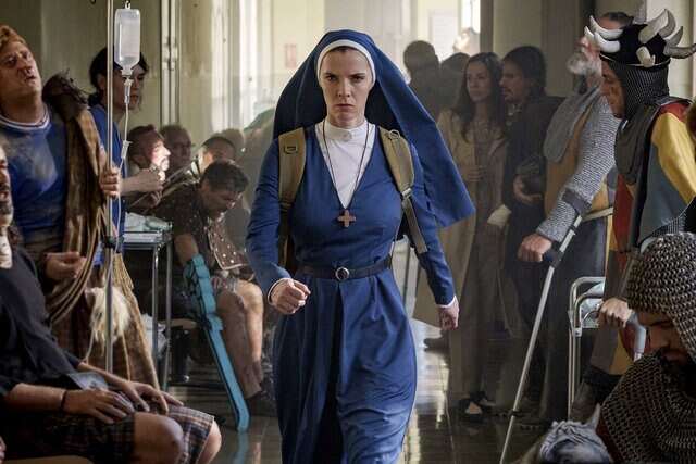 Betty Gilpin as Simone storms down a hallway in Mrs. Davis