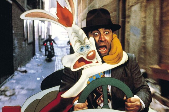 Roger Rabbit embraces Bob Hoskins in a car in Who Framed Roger Rabbit (1988)